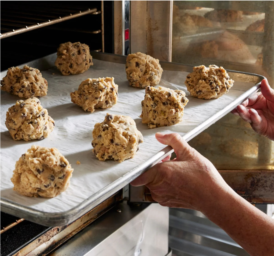 Freshly baked Levain cookies on baking sheet
